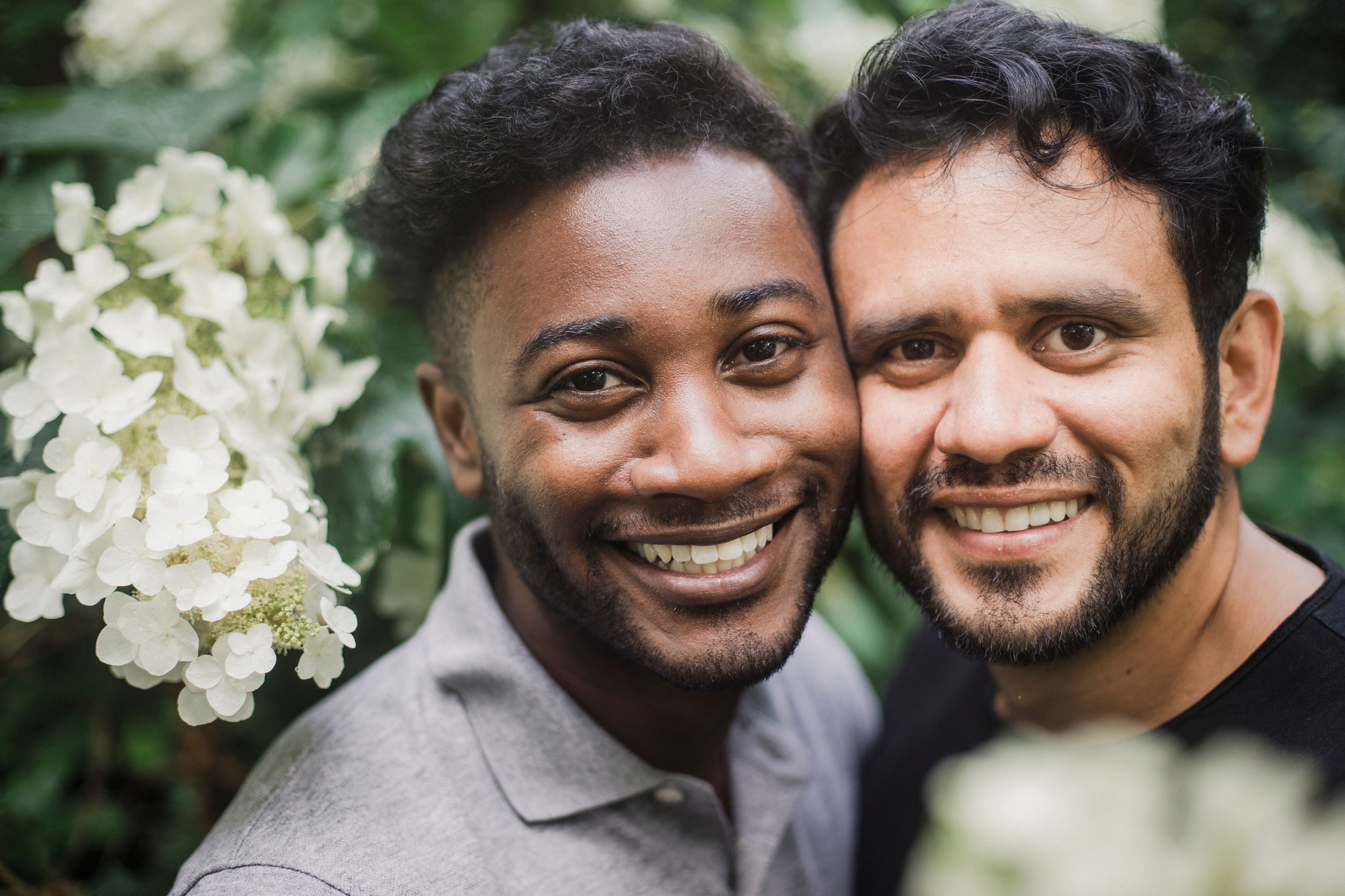Photograph of Men Smiling Side to Side · Free Stock Photo