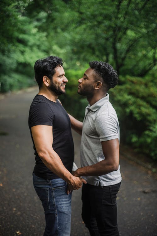 Photo of Men Looking at Each Other Face to Face