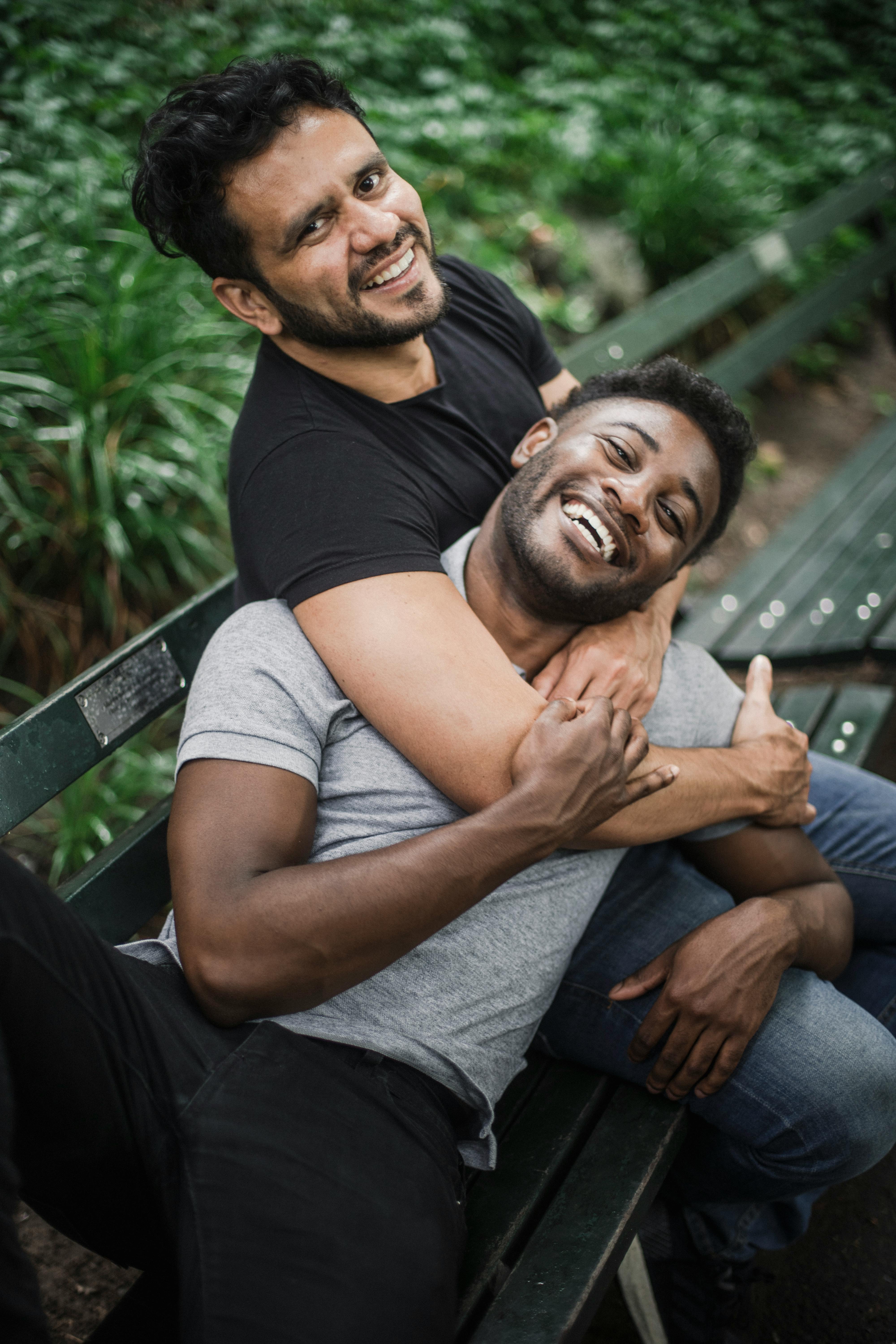 photograph of men smiling together