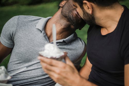 Free Two Men Holding an Ice Cream and Kissing Stock Photo