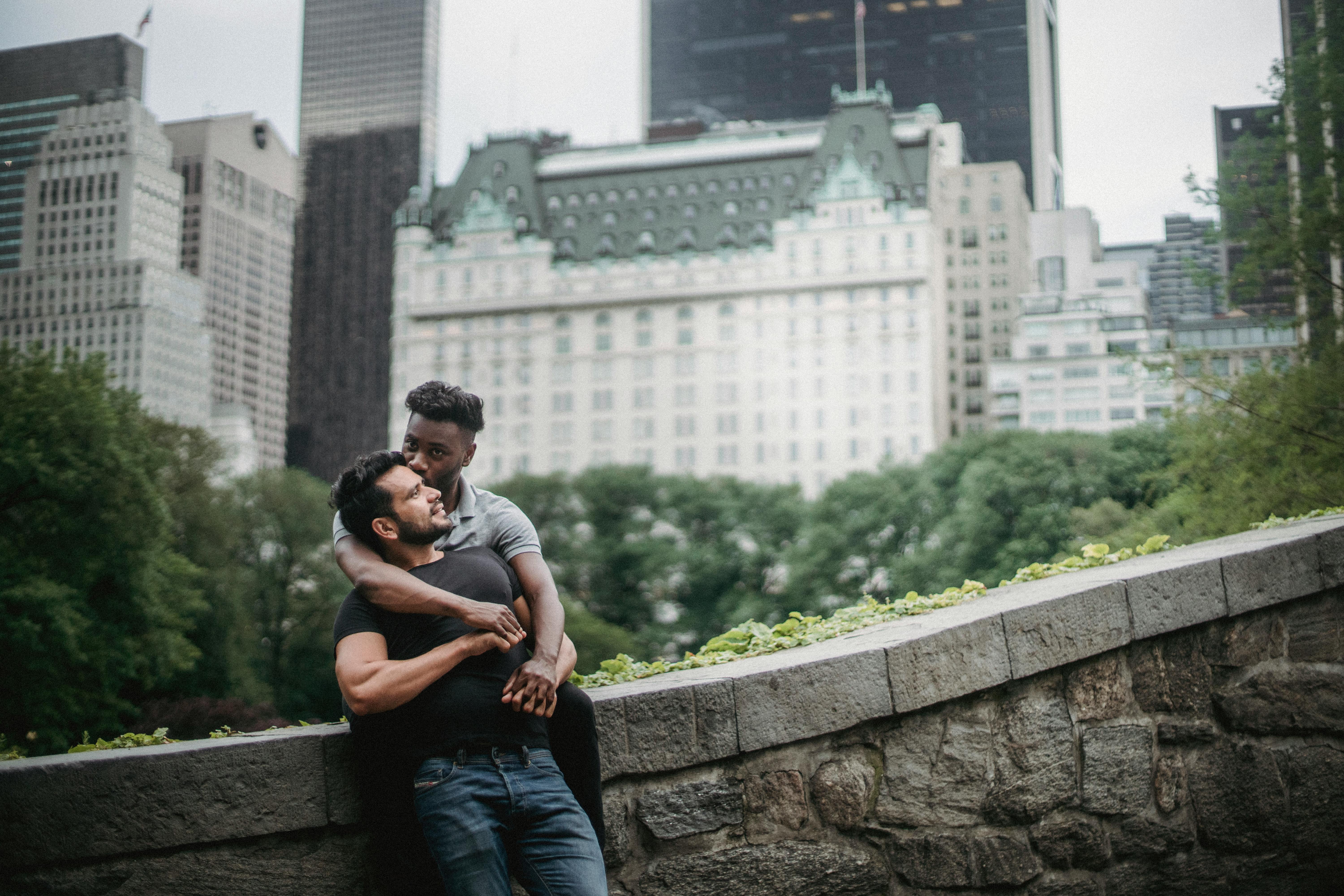 A loving couple enjoying a tender moment in Central Park, New York City.