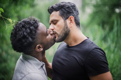 Two Men Kissing Outside
