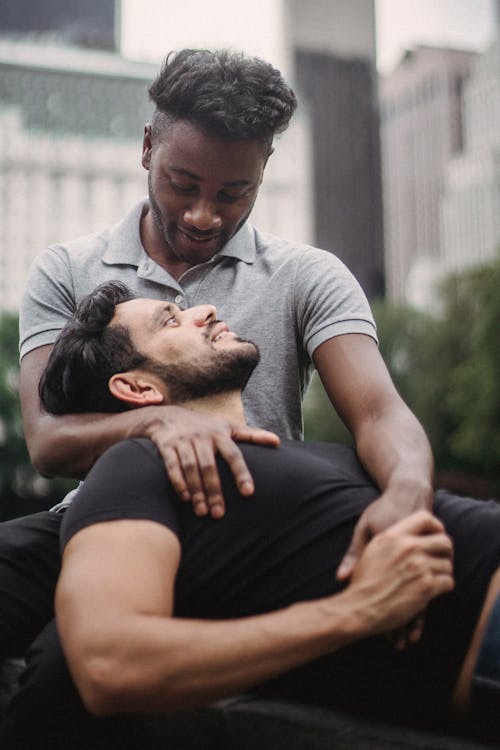 Portrait of Two Men on Bench in City