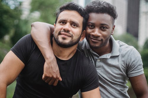 Free Portrait of Happy Men Hugging Stock Photo