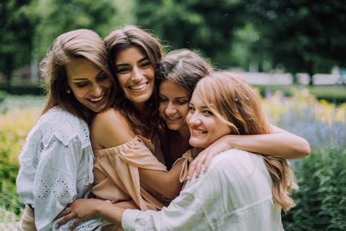 Free Women Hugging and Smiling Stock Photo