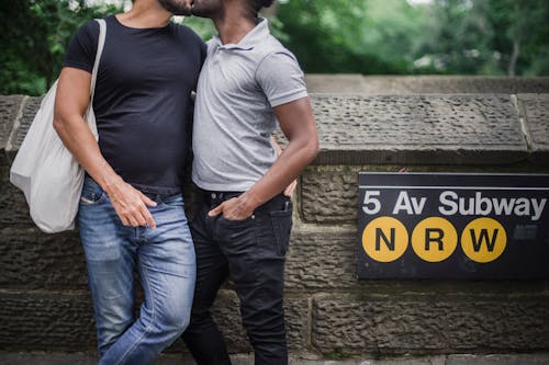 Free Two Men Standing Close to Each Other and Kissing Stock Photo