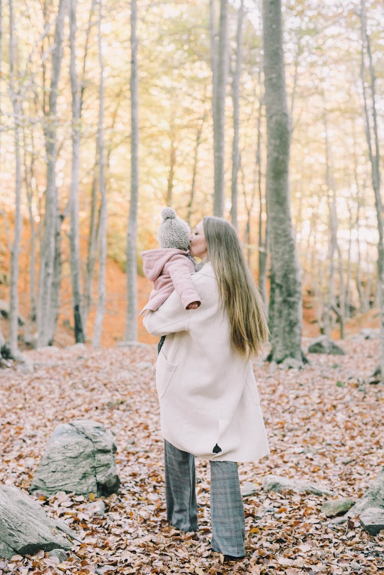 Woman Kissing Her Baby