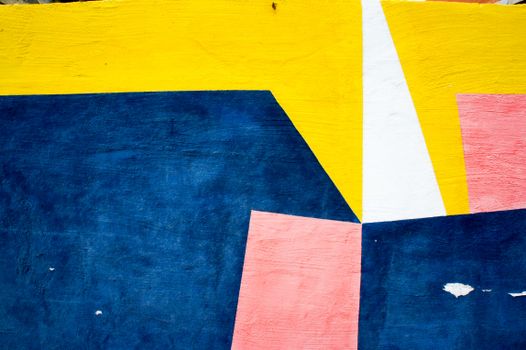 Colorful geometric abstract art with vibrant yellow, blue, and pink shapes.