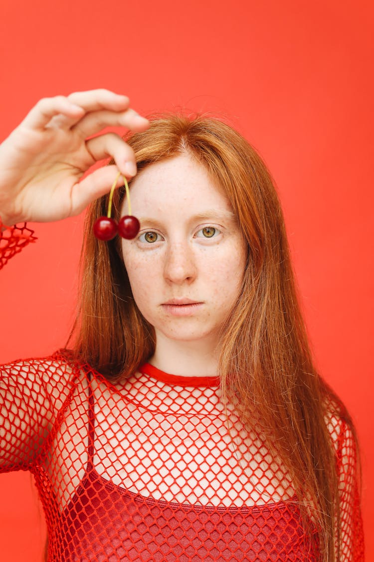 Woman Holding Cherries