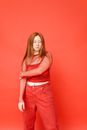 Woman in Red and White Checkered Button Up Shirt and Red Denim Shorts