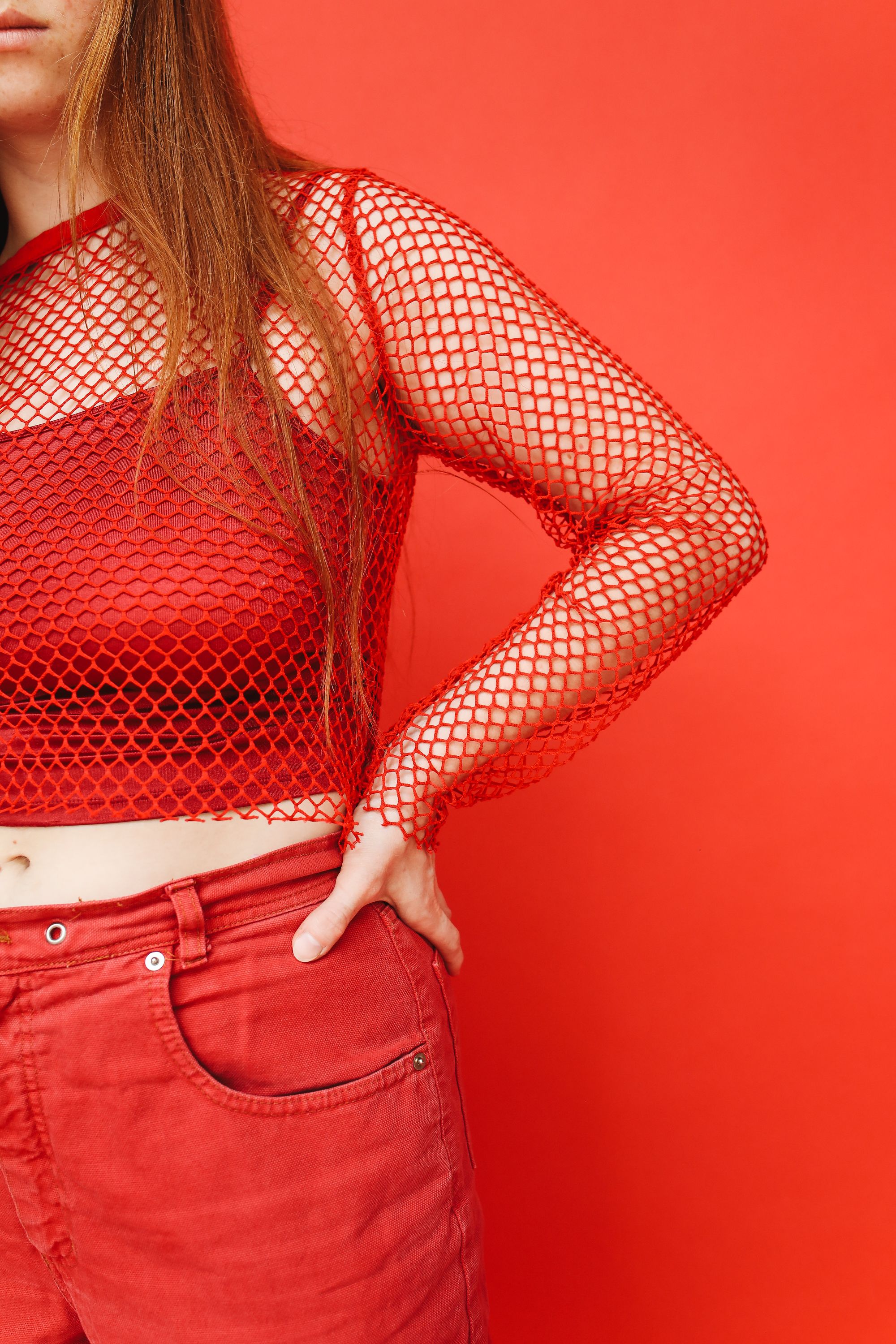 A Woman in a Red Outfit Posing · Free Stock Photo