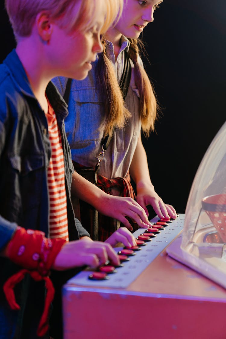 Woman In Black Leather Jacket And Man In Blue Jacket Playing Piano