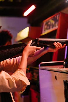 A teenager enjoys a classic shooting game at a retro arcade, capturing nostalgic vibes.