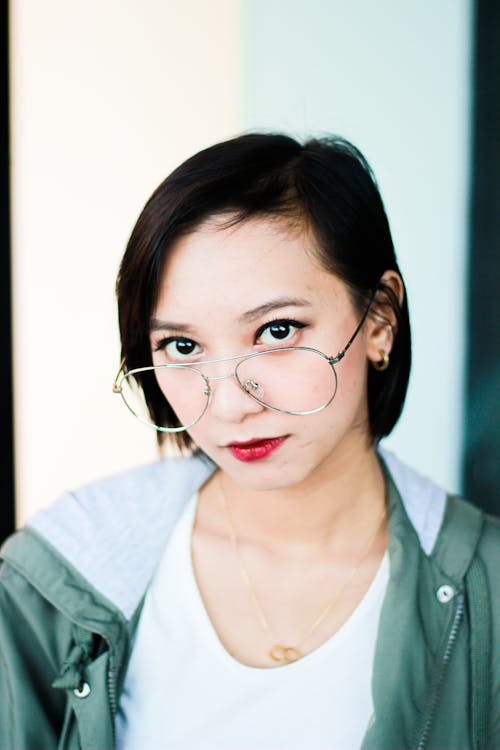 Woman in White Shirt Wearing Eyeglasses