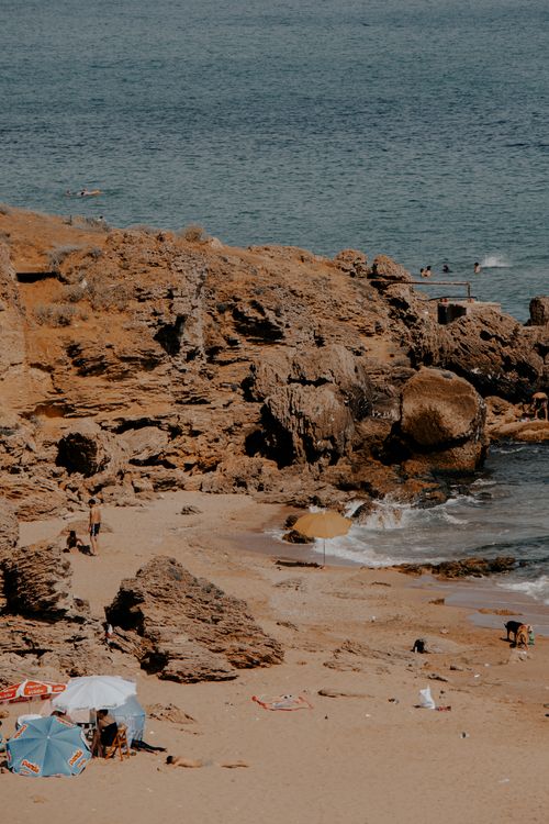 Free A sunny day at Şile's rocky beach in İstanbul, with tourists enjoying the seaside. Stock Photo