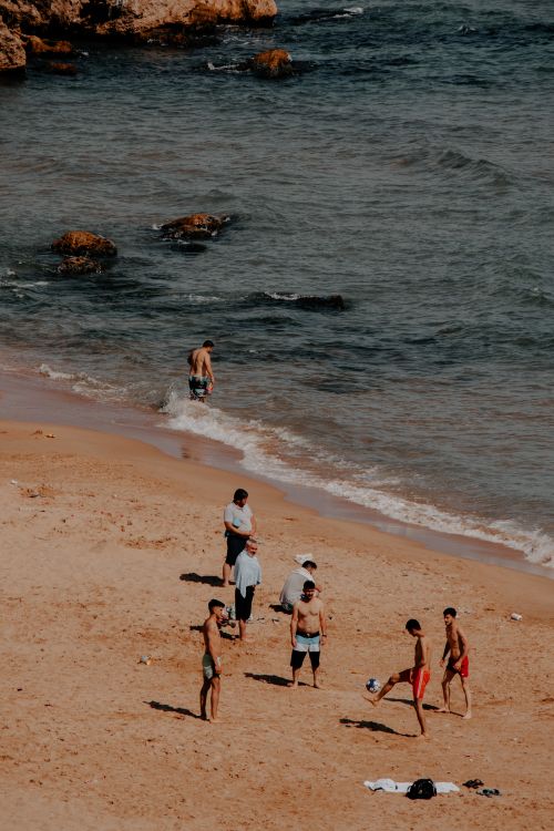 Free People enjoying a sunny day on Şile Beach, İstanbul with beach activities and playing in the sea. Stock Photo