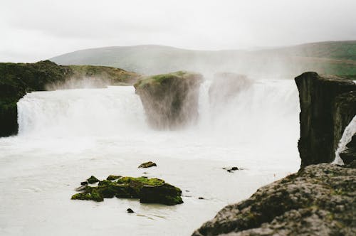 Waterfalls Under the Cloudy Sky