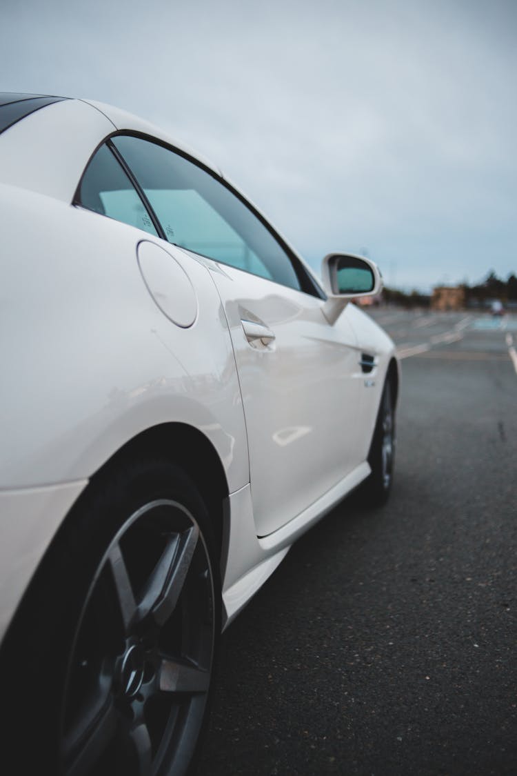 Luxury White Coupe Car Parked On Road In Suburb