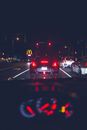 Traffic on city street through modern car windscreen