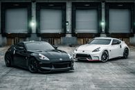Shiny new coupe cars parked near warehouse