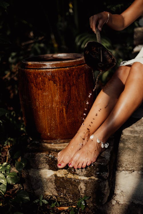 A Woman Washing Her Feet