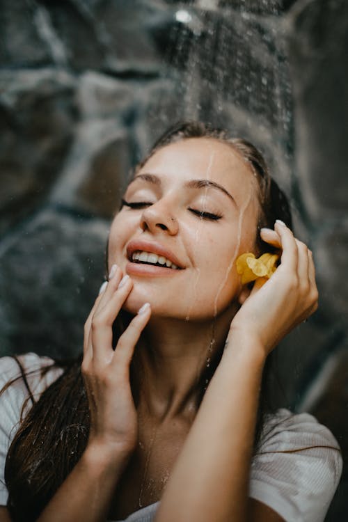 Close-Up Shot of a Woman Taking a Shower