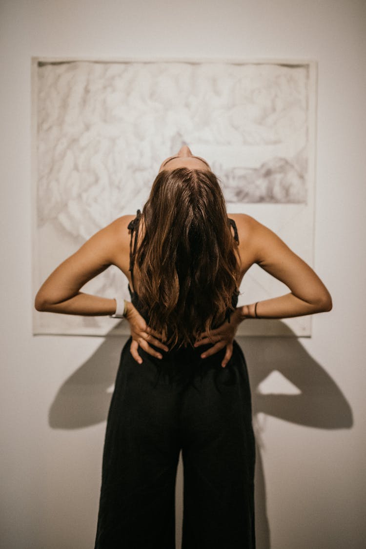 Woman In Black Clothes Leaning Back