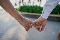 Man and Woman Holding Hands