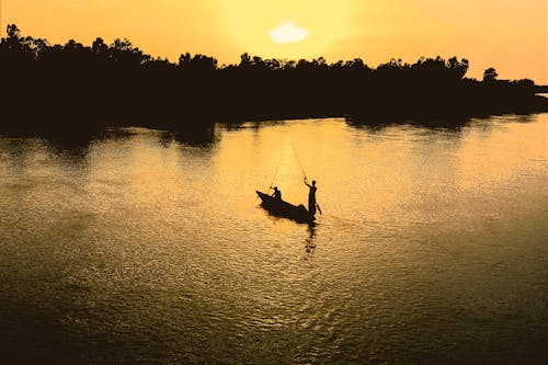 Silhouette People Fishing in a Lake