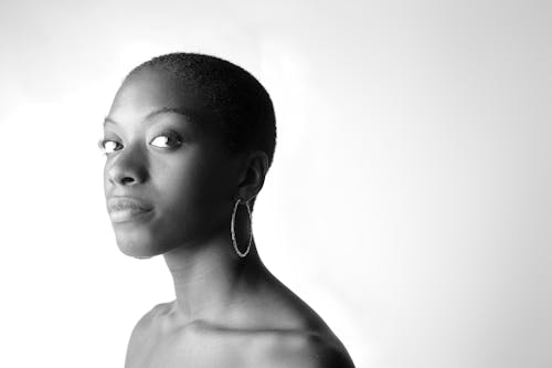 Grayscale Photo of a Woman with Hoop Earrings
