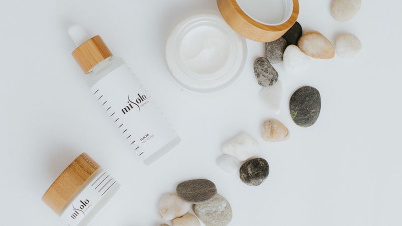 Luxury vegan body care products on white background