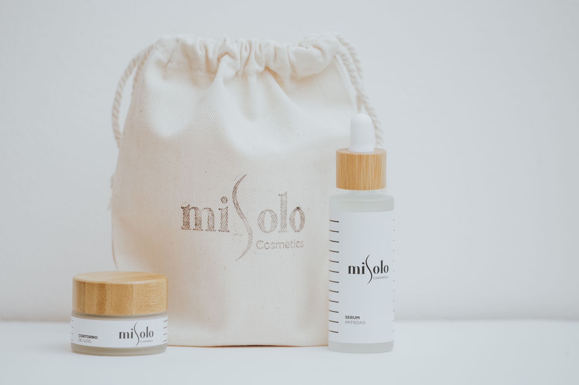 Elegant skincare products with natural packaging on a white background.