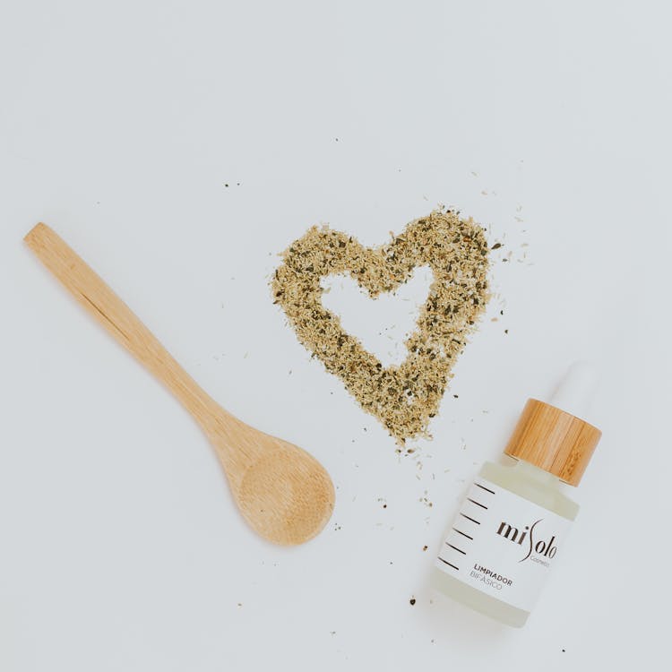 Beauty Product Bottle With Spoon And Heart From Salt