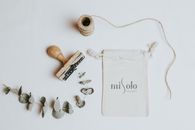 White Ceramic Mug Beside Silver and Silver and Silver and Silver and Silver and Silver and