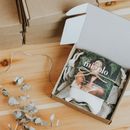 White Earbuds on Brown Cardboard Box