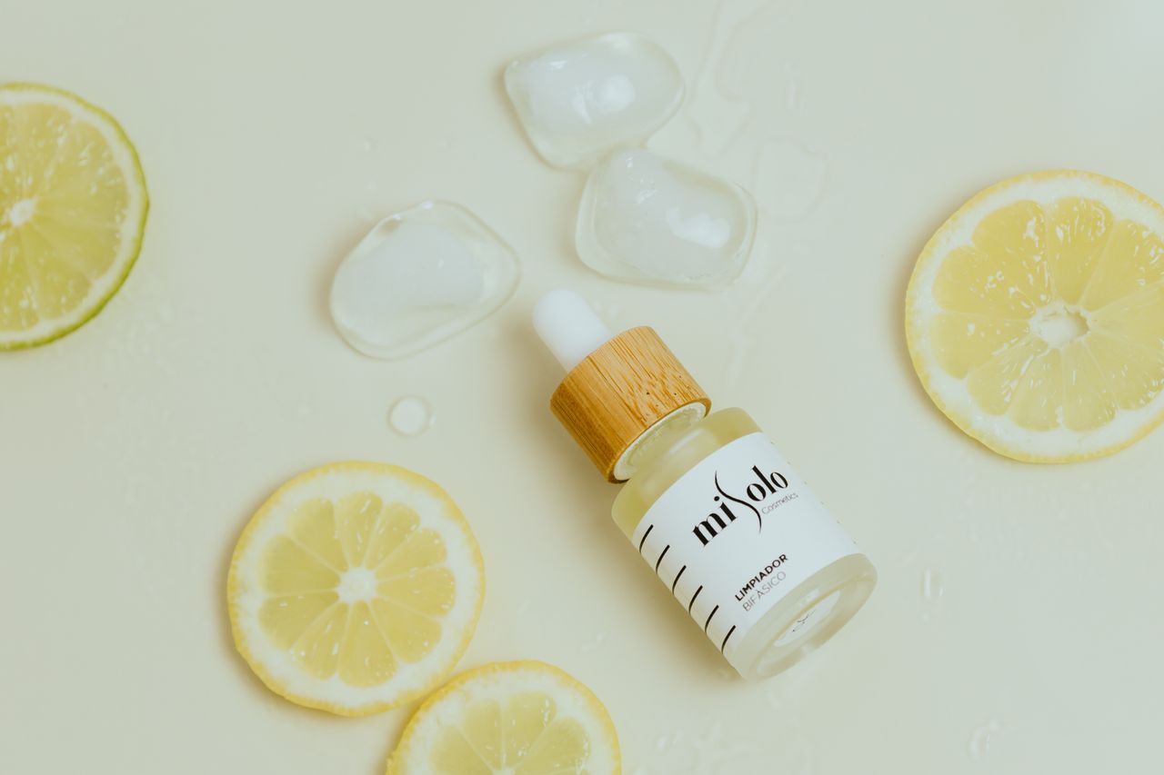 vitamin C serum bottle product still life on soft cream background