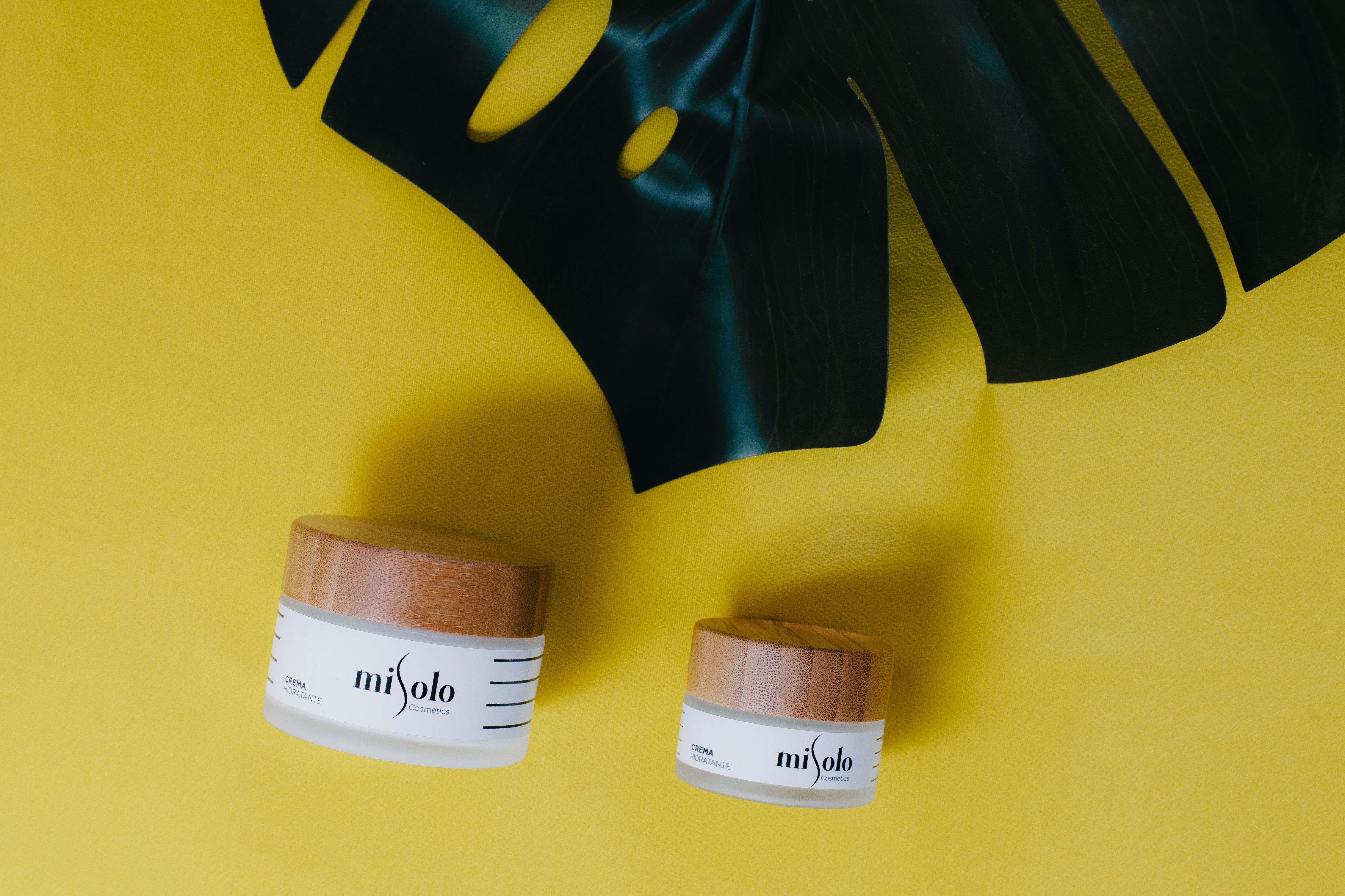 close-up-shot-of-skincare-products-on-a-yellow-surface-free-stock-photo