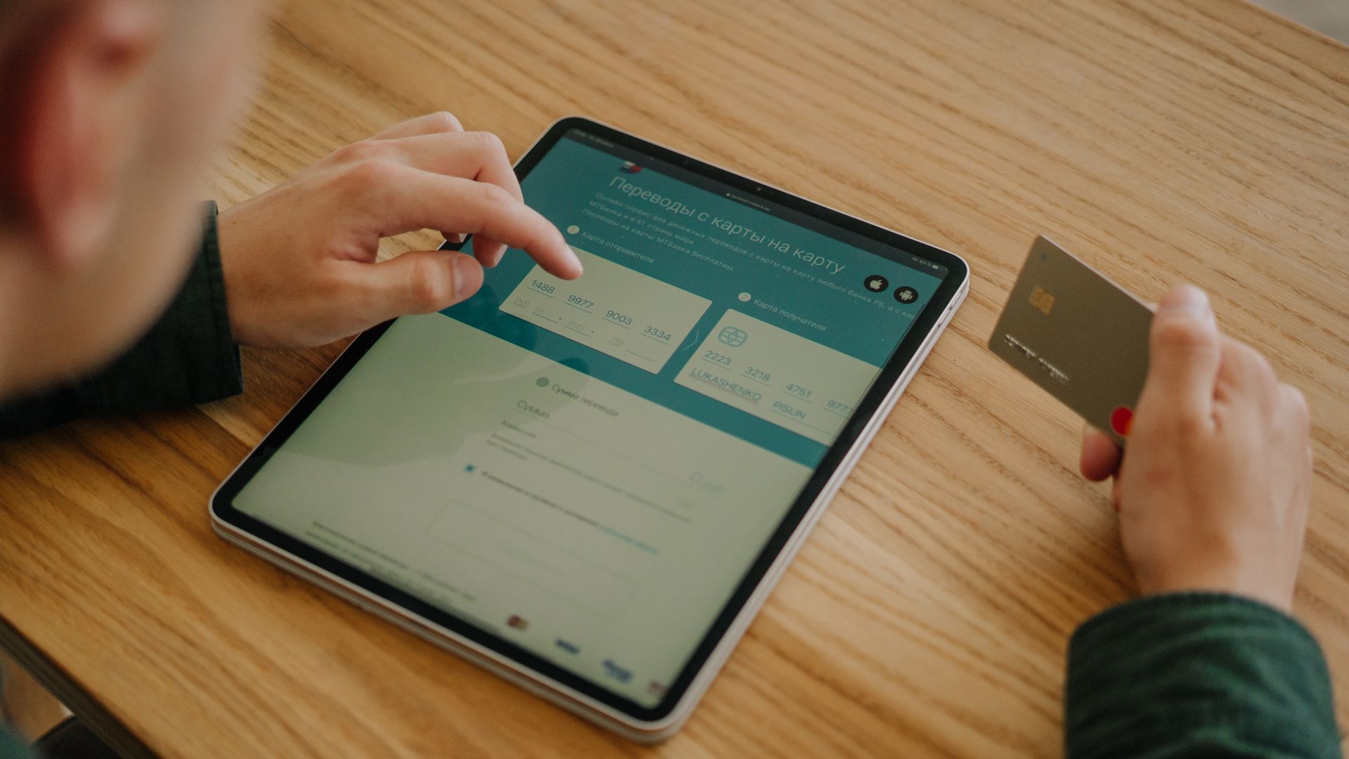 Modafinil Credit Card Payment Online: Secure and Convenient Person making an online payment using a tablet and credit card on a wooden desk — modafinil credit card payment online