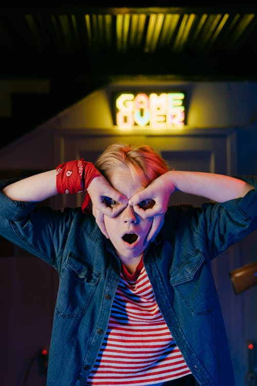 Woman in Blue Denim Jacket Wearing White Mask