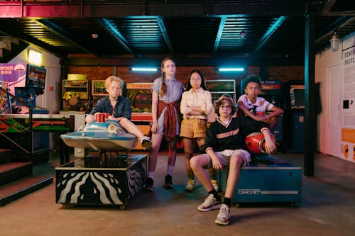 Group of People Sitting on Blue Table