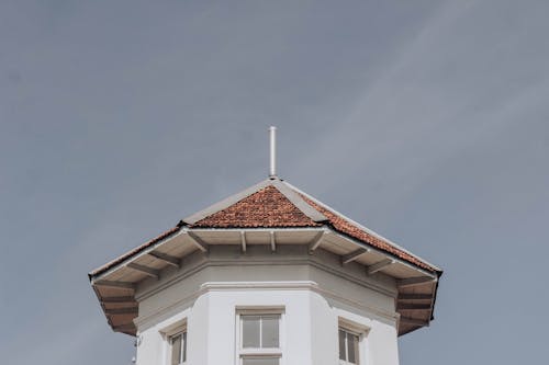 White and Brown Concrete Building Under Blue Sky