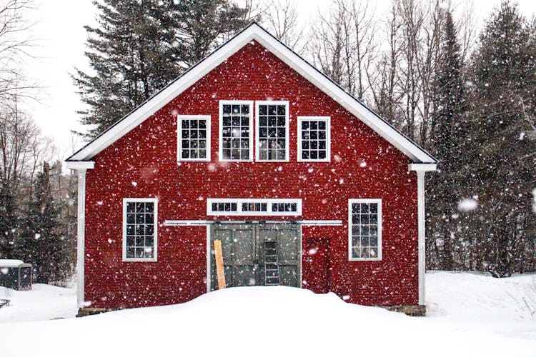 A Red House On Snow Covered Ground