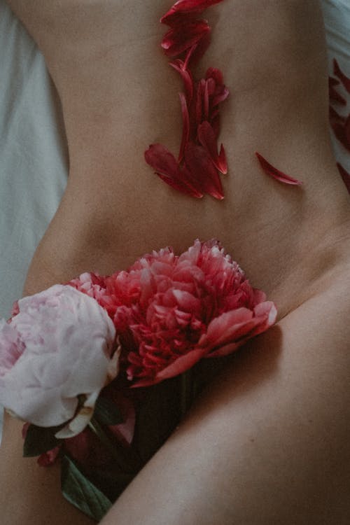 Close-Up Shot of Flowers on a Female's Body