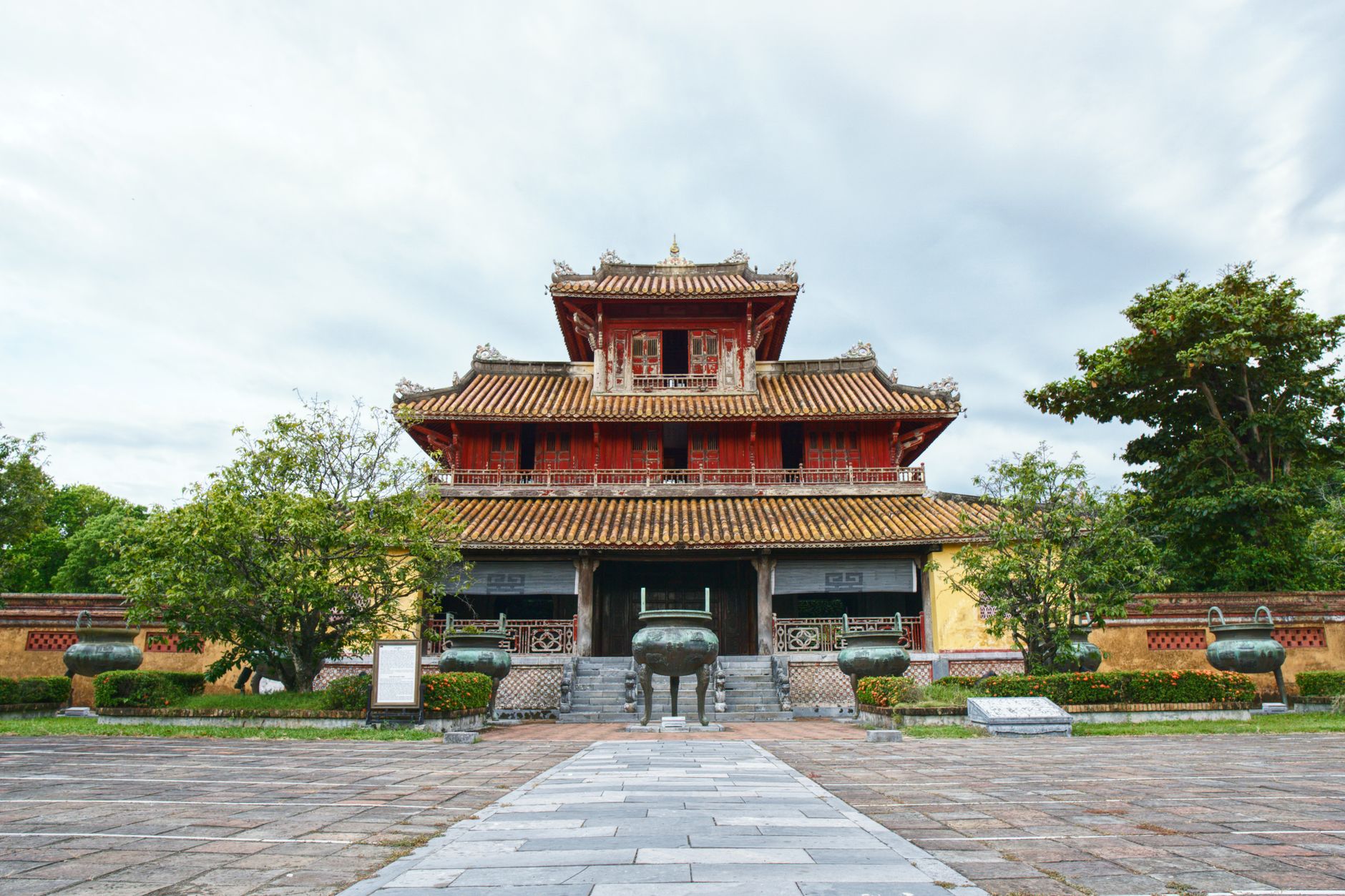 A beautiful pagoda-style temple surrounded by lush trees in a tranquil outdoor setting.