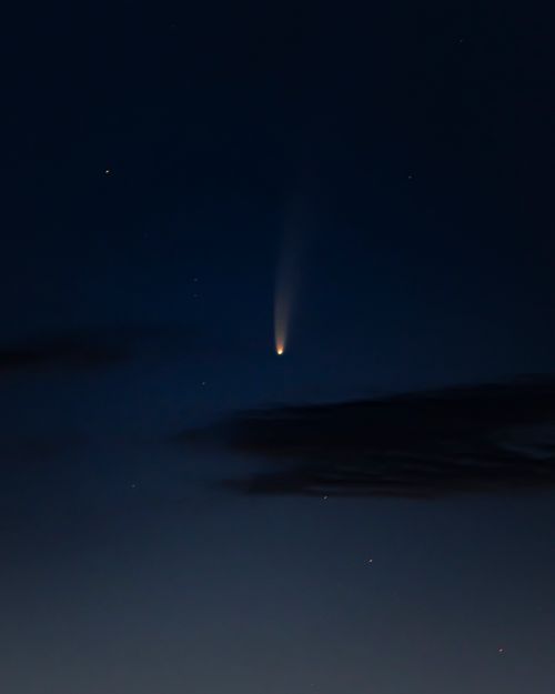 Free Bright star falling down amidst clouds on dark sky at night in nature Stock Photo