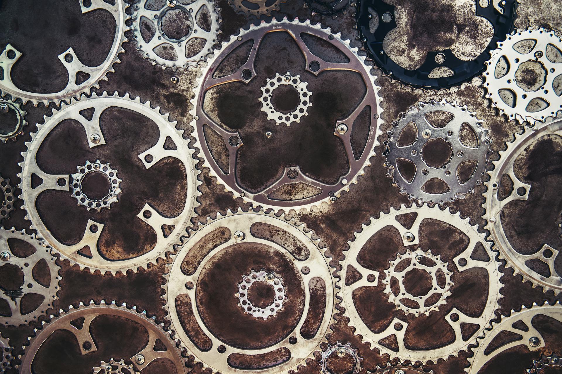 Close-up of interlocking metal gears creating an industrial texture.