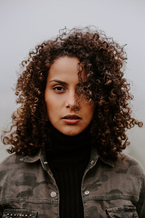 Close-Up Shot of a Curly-Haired Woman