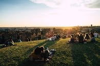 People Having a Picnic with a View of a City
