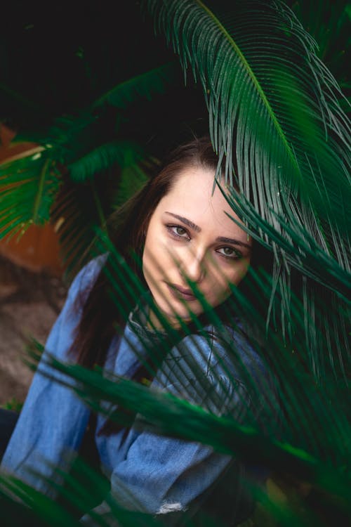 Beautiful Woman Near a Plant