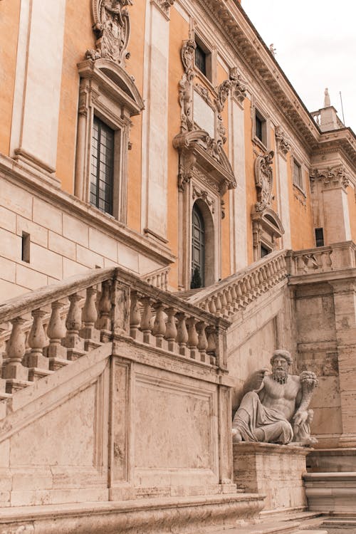 Facade of old stone building with sculpture